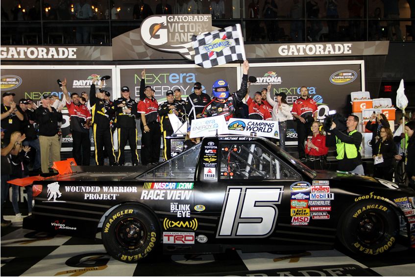 Michael Waltrip celebrates in victory lane with his No.15 crew after winning the 2011 NextEra Energy Resources 250 at Daytona International Speedway in Daytona Beach, Fla. Credit: Jerry Markland/Getty Images for NASCAR